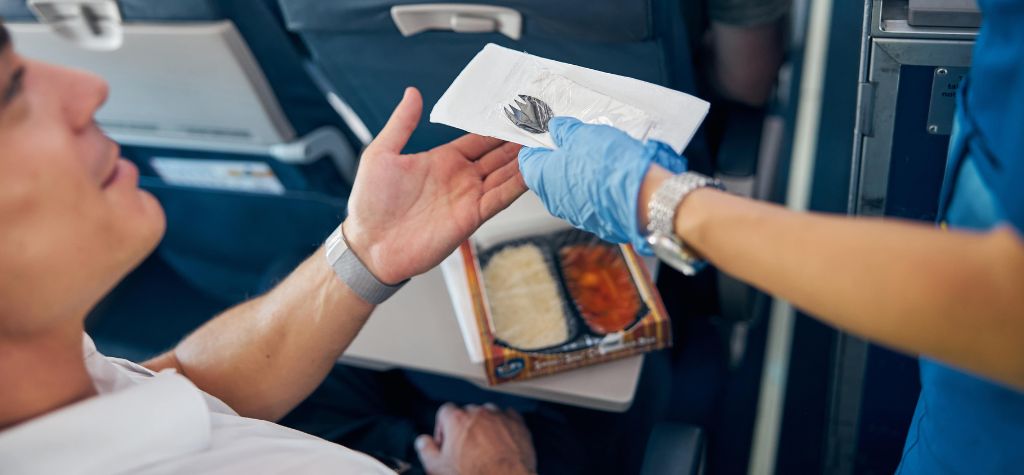 ecofriendly business travel green sustainable toiletries airlines plane plastic cutlery